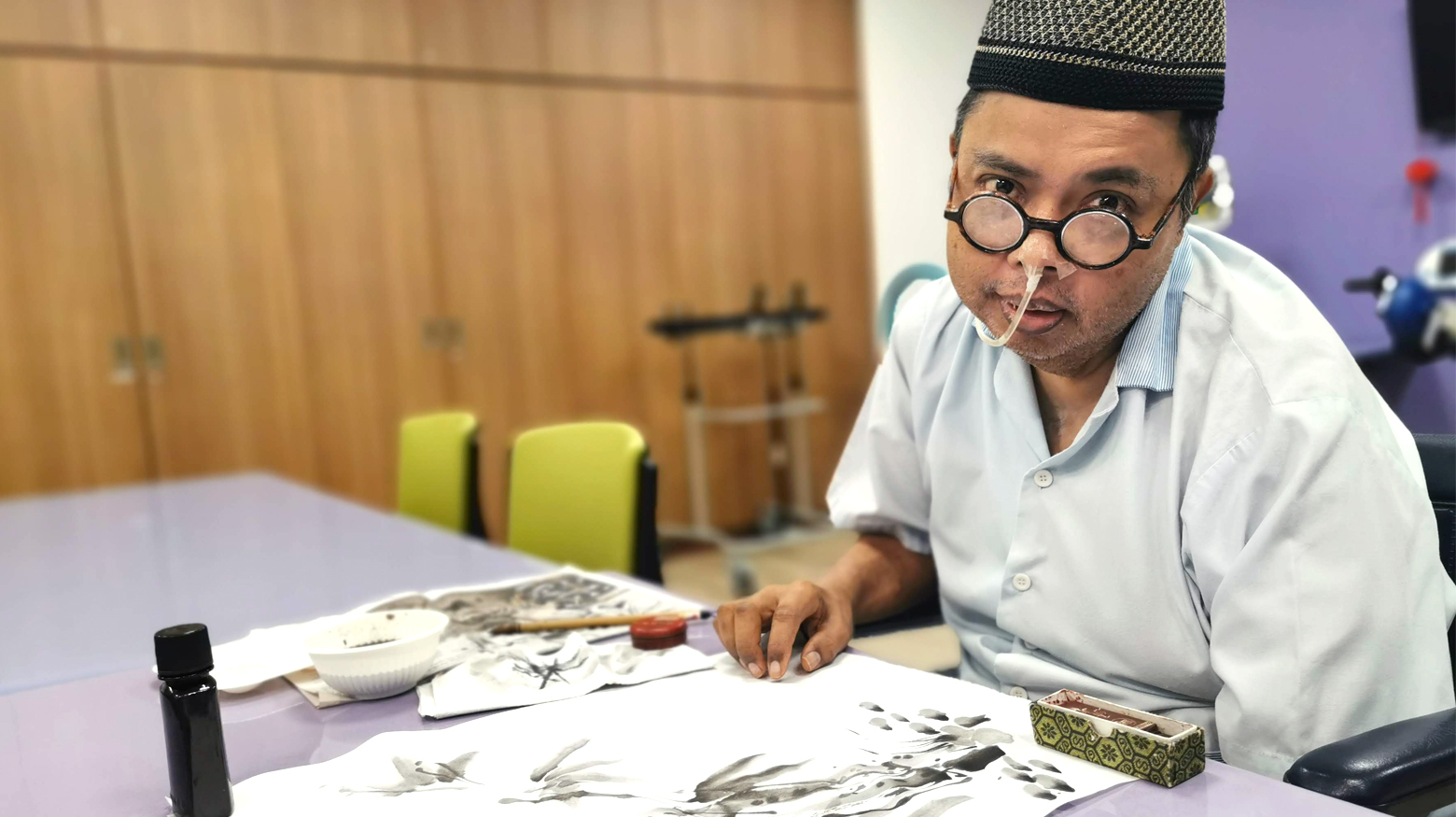Mr Azman in the middle of this Chinese Bamboo painting at St. Andrew’s Nursing Home, Taman Jurong.