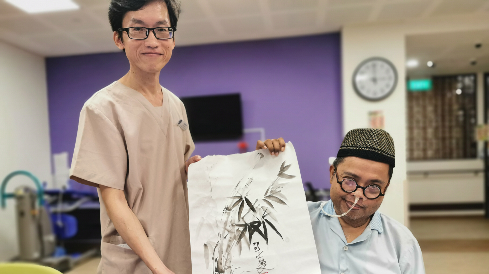 Mr Azman shows off his finished work, along with Jason, who often stands by him and helps out when necessary.