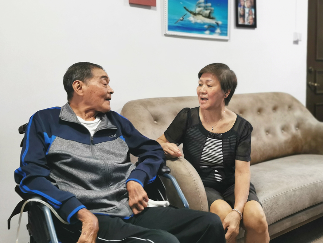Mdm Tay and Mr Lim, who is sitting in a wheelchair subsidised by Seniors’ Mobility and Enabling Fund (SMF)