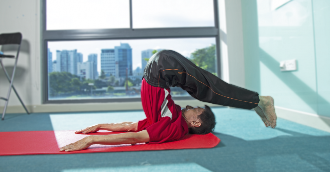 senior showcasing yoga pose senior showcasing yoga pose