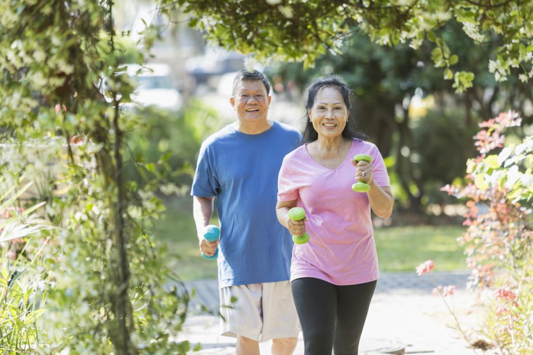 Couple jogging with weights. Exercise is a great way to beat stress.